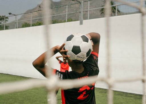 boy throwing the ball in during a soccer game at xtreme soccer field